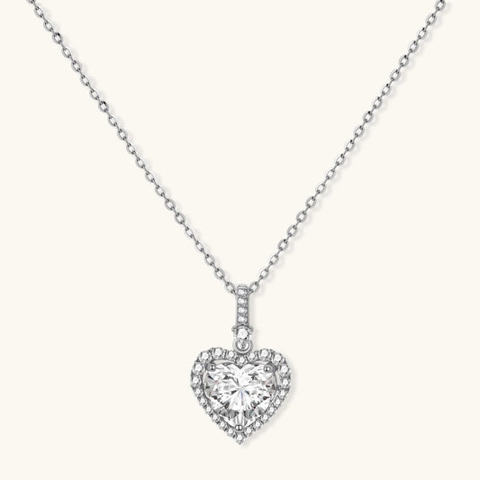 Complete jewelry set with heart-shaped sterling silver pieces featuring brilliant moissanite stones on white background.